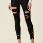 Black Color High Rise Distressed Skinny Jeans with a Raw Hem